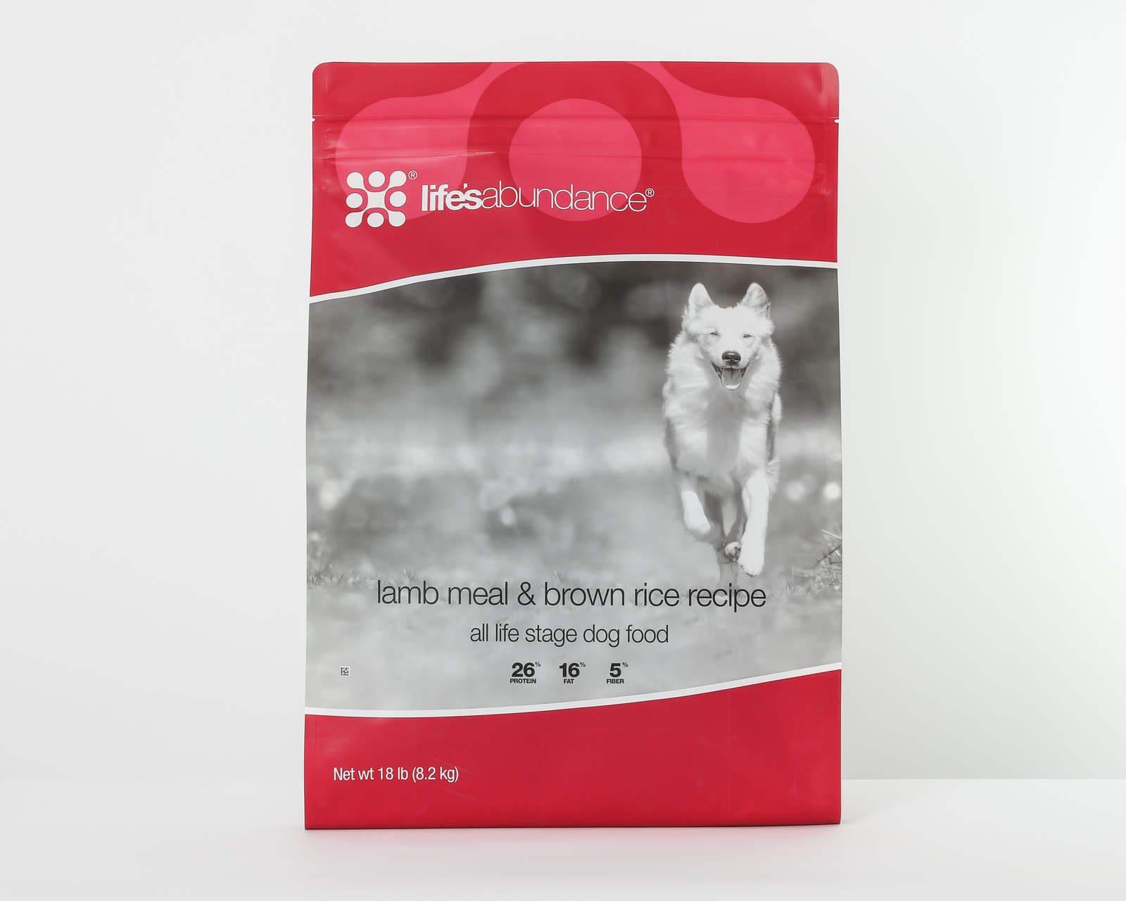 Bag of Life's Abundance lamb meal and brown rice dog food on a white studio background