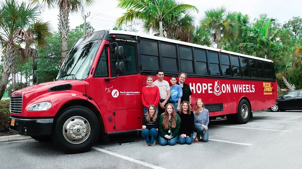 Life's Abundance volunteers in front of the Hope on Wheels rescue bus