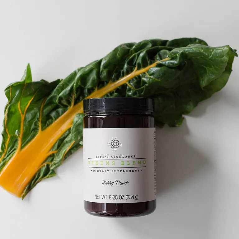 Life's Abundance Greens Blend supplement with fresh chard