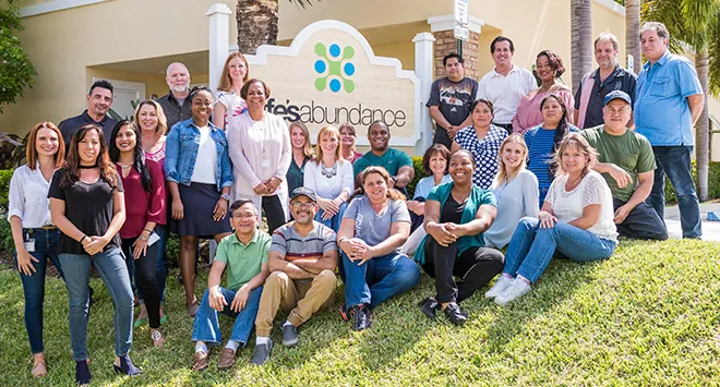 The Life's Abundance team in front of headquarters