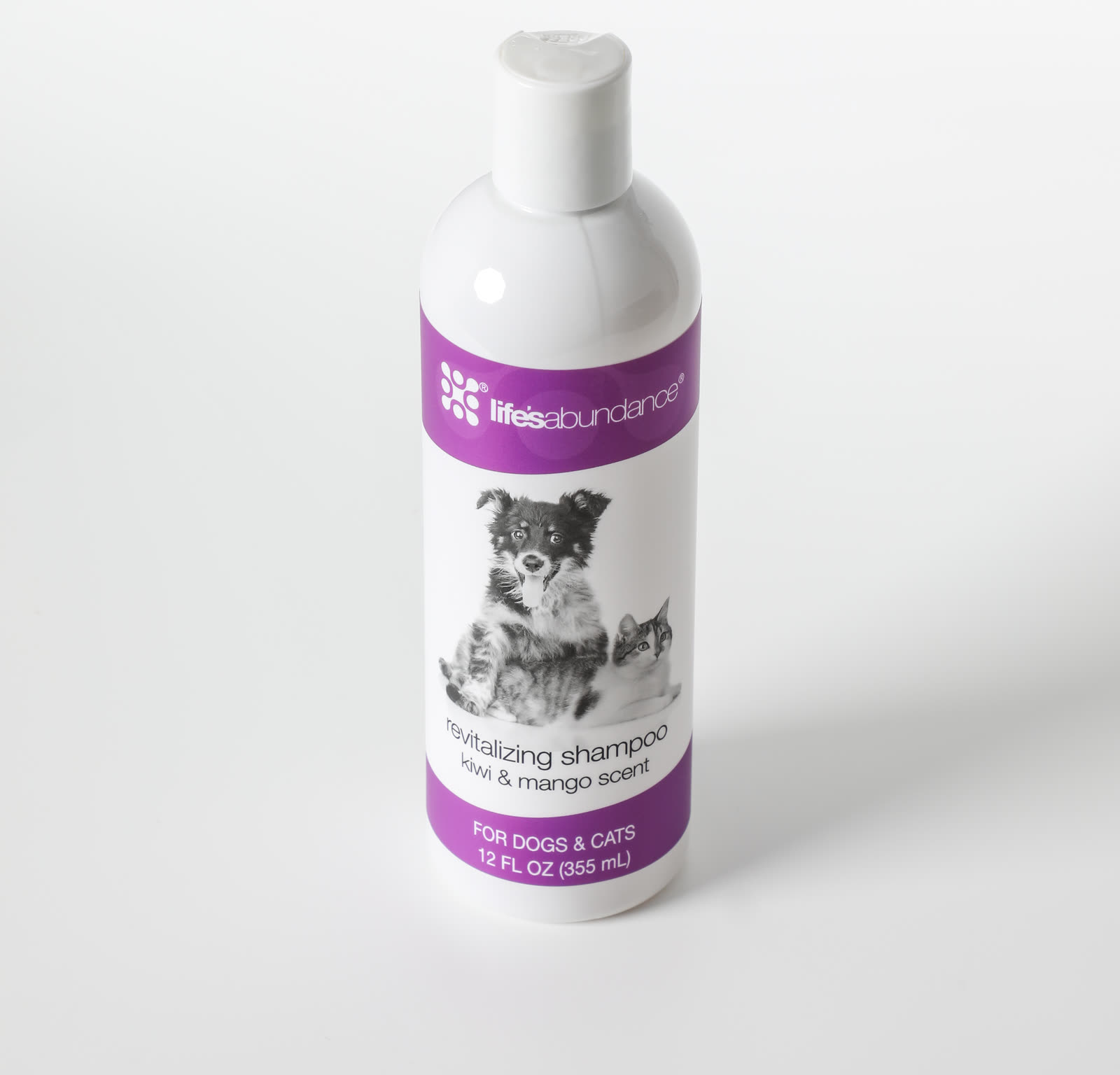 Revitalizing Shampoo 12 oz bottle photographed at an angle on a white studio background